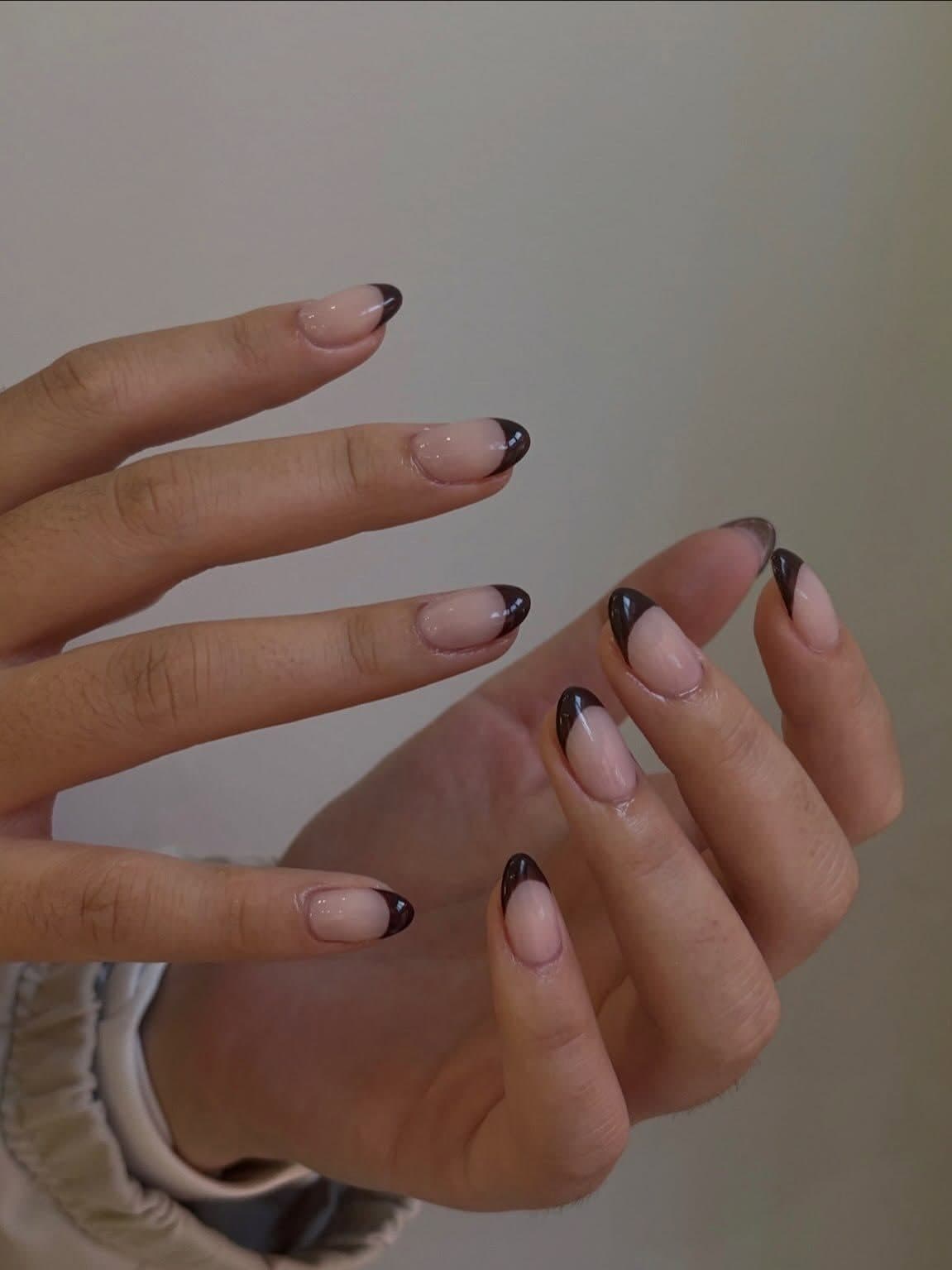 Sheer nude Korean gel almond nails with thin dark brown French tips by Joy Nail Studio Vancouver